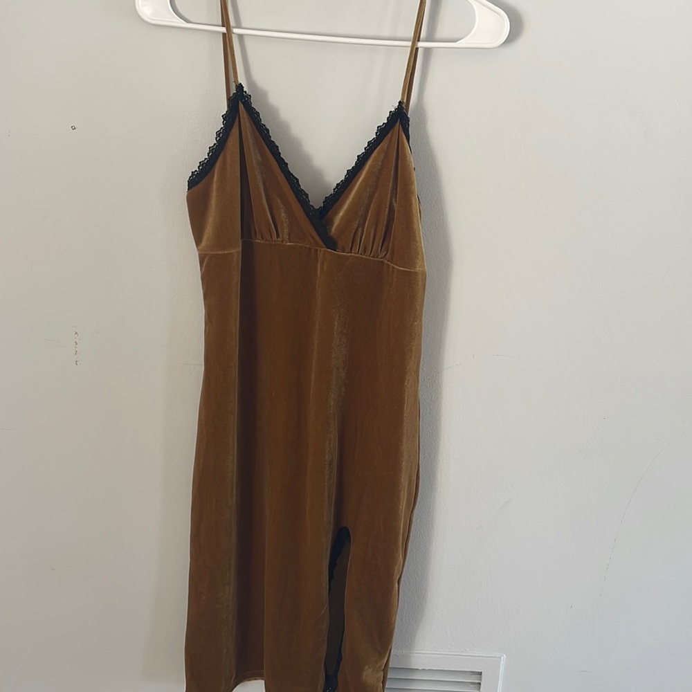 Dark gold velvet stretchy dress with slit in front. Never worn